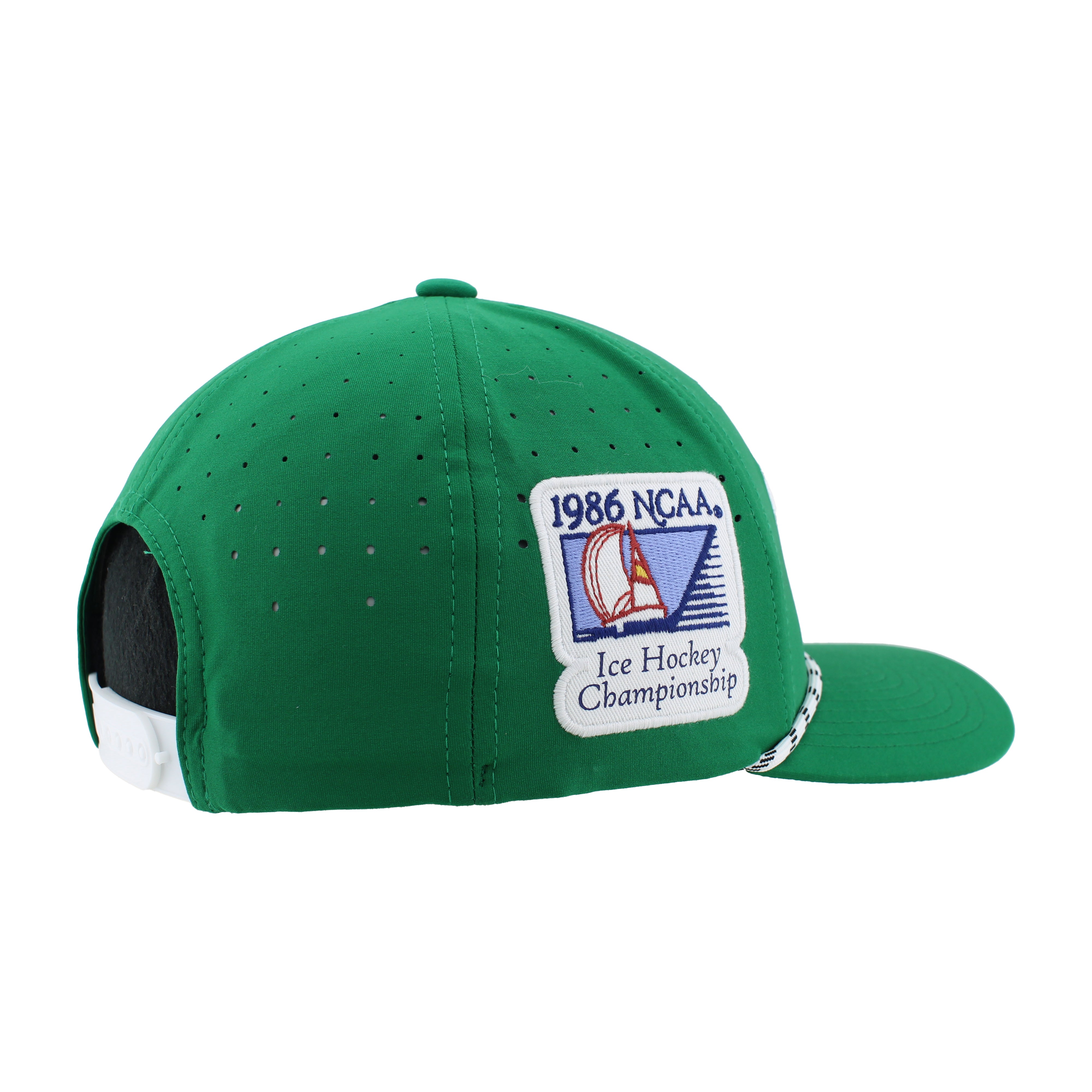 Side view on a bright green hat with a white plastic adjustable clasp at the back and a 1986 NCAA Ice Hockey Championship patch on the right side of the hat. Along the bill of the hat is a white and green thin rope.