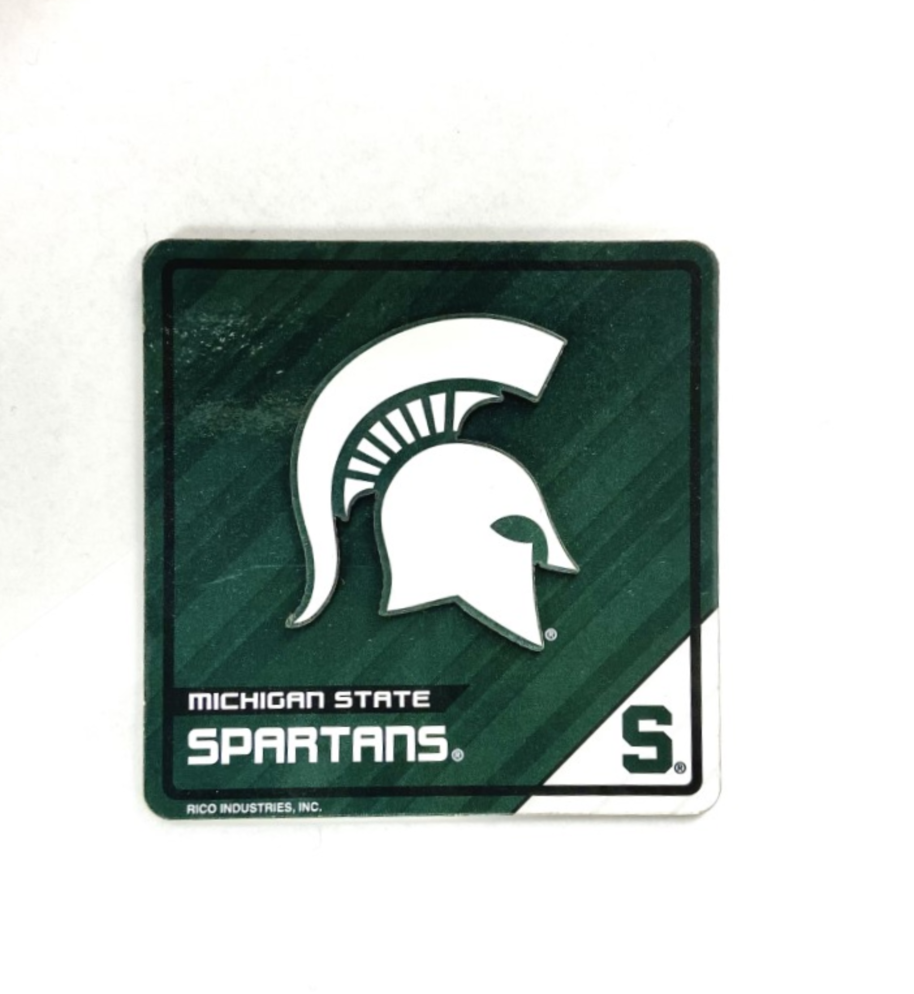 A green magnet with a white Spartan helmet that reads "Michigan State Spartans."