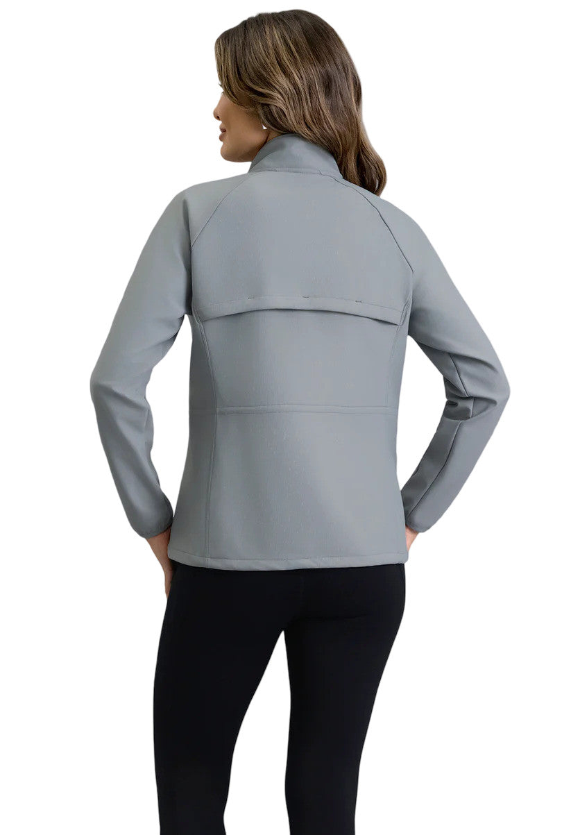 Woman wearing a gray jacket, showing the back.