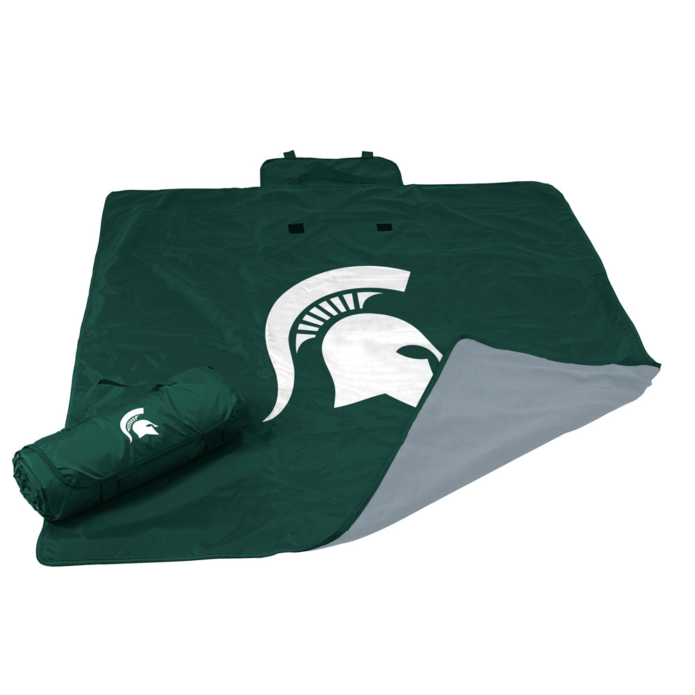 A green blanket with a white Spartan helmet logo in the center. The back side of the blanket is gray.