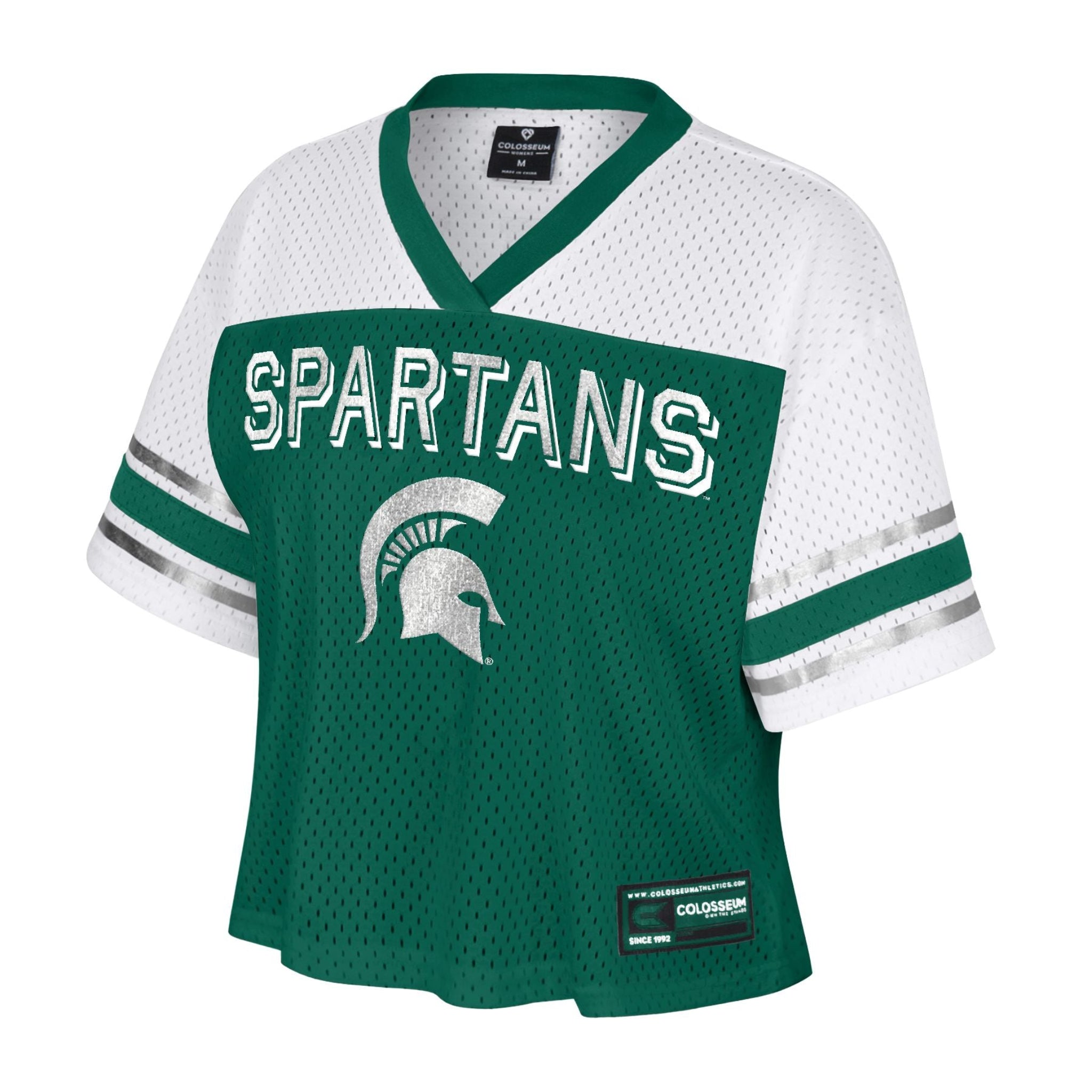 Green sports jersey with white sleeves featuring two green stripes and one silver stripe near the ends, 'SPARTANS' in large white letters outlined in green across the chest, a Spartan helmet graphic below.