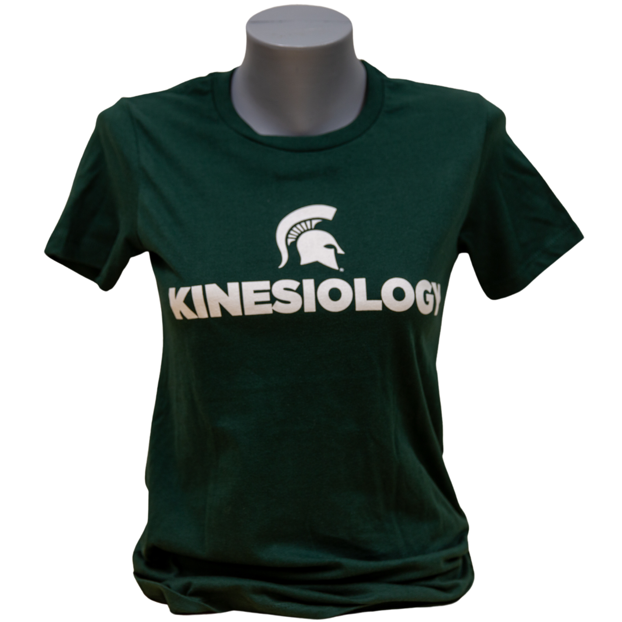 Forest green short-sleeve women's crewneck t-shirt with a white Spartan helmet over text reading kinesiology in all caps.