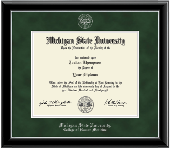 Framed Michigan State University diploma in a black glossy frame with a silver inner edge. The matte is dark green, featuring the university seal at the top center and 'Michigan State University' written in silver at the bottom center.