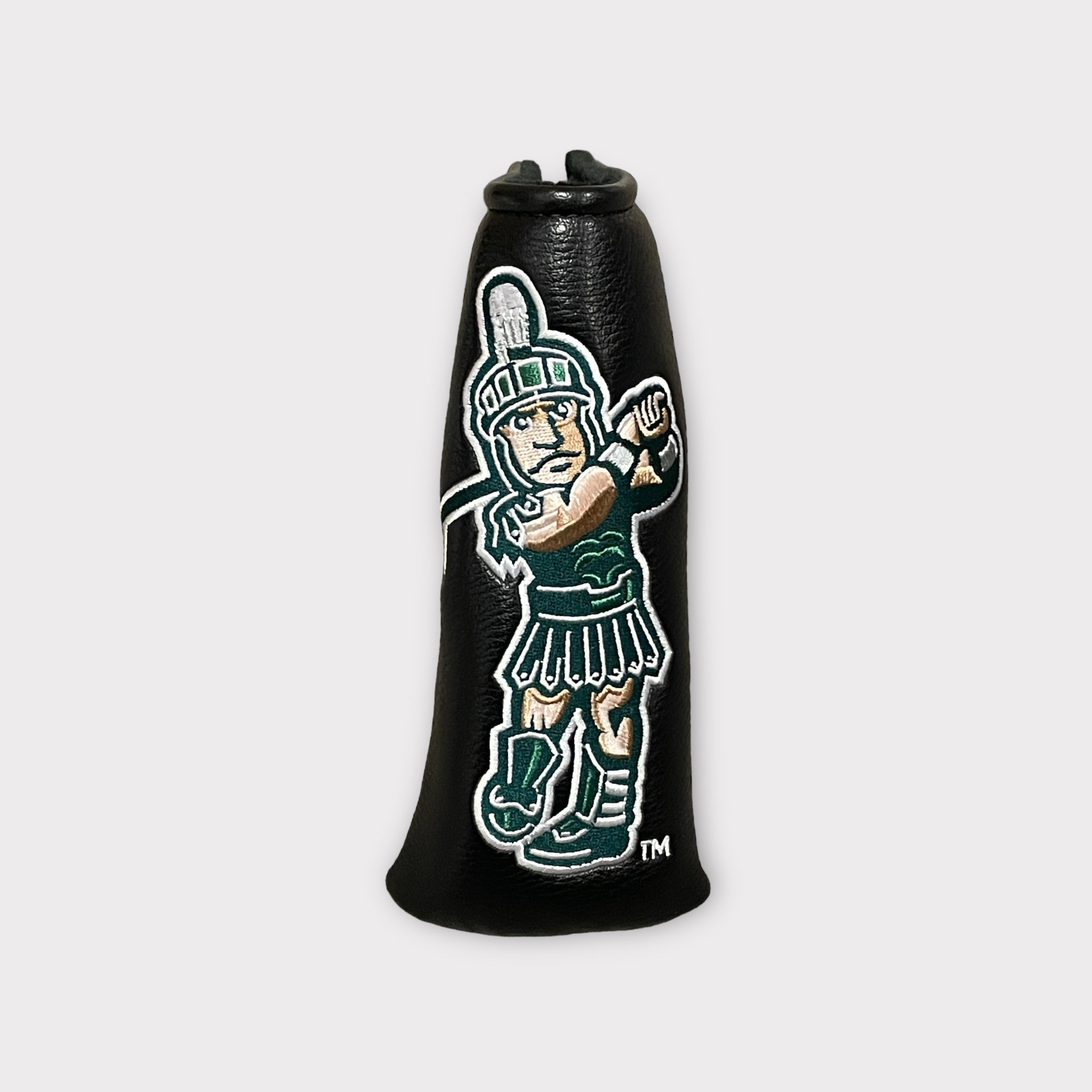 A black leather head cover featuring an embroidered golfing Sparty logo.