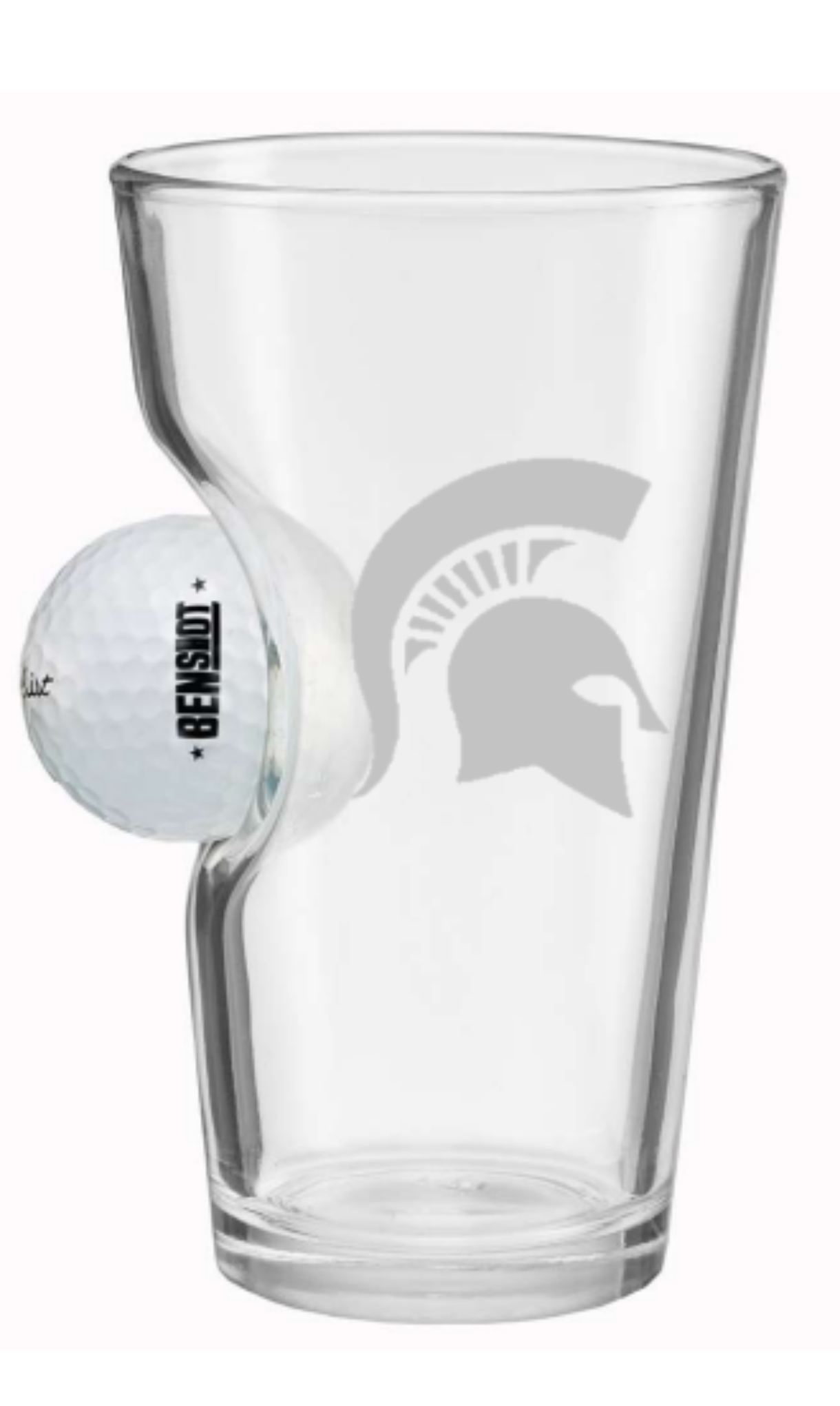 A clear pint glass with a real embedded Titleist golf ball on one side, featuring a laser etched Spartan helmet on the other side.