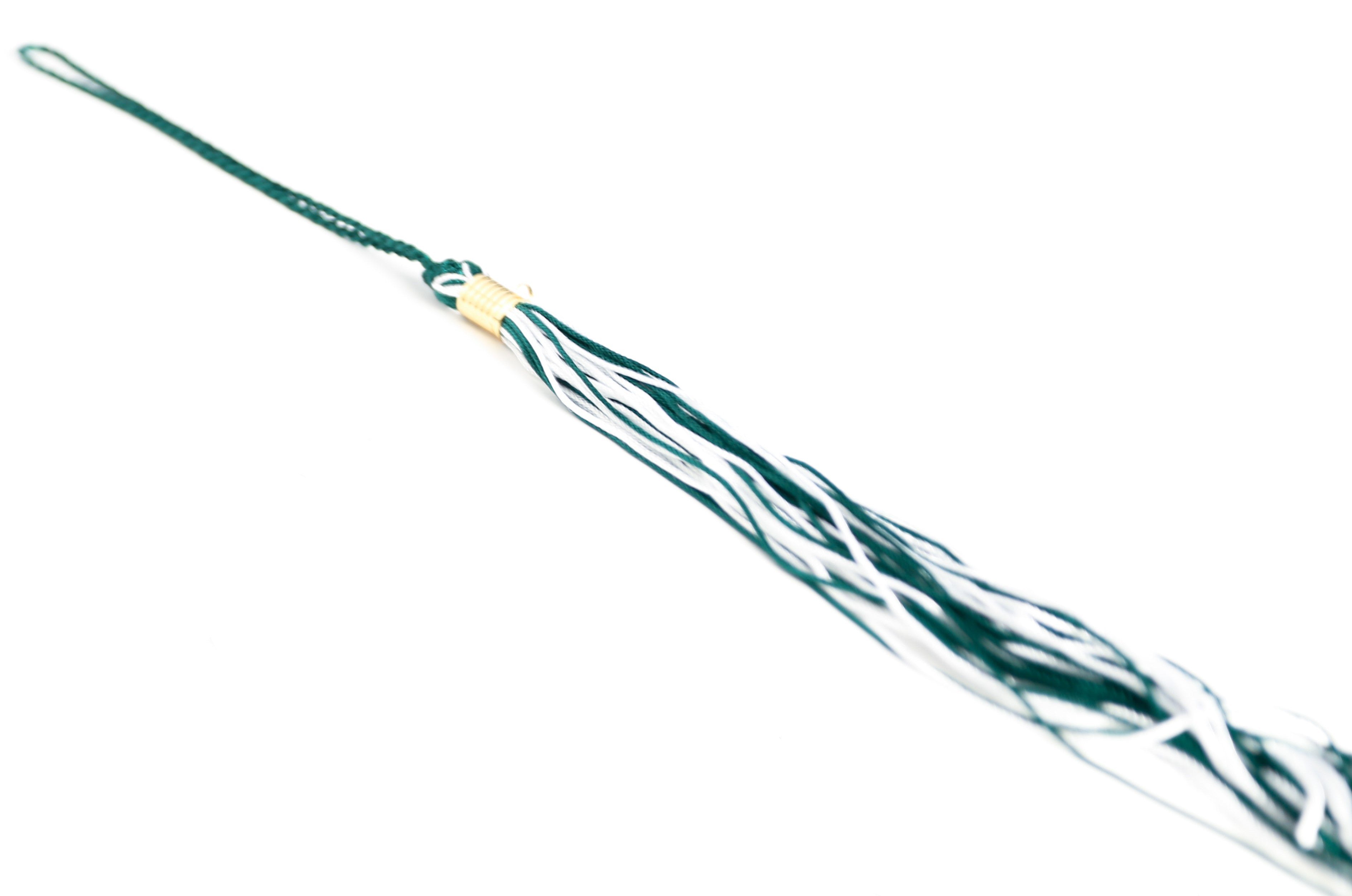 Green and white graduation souvenir tassel with gold clasp. Shown on a white background.