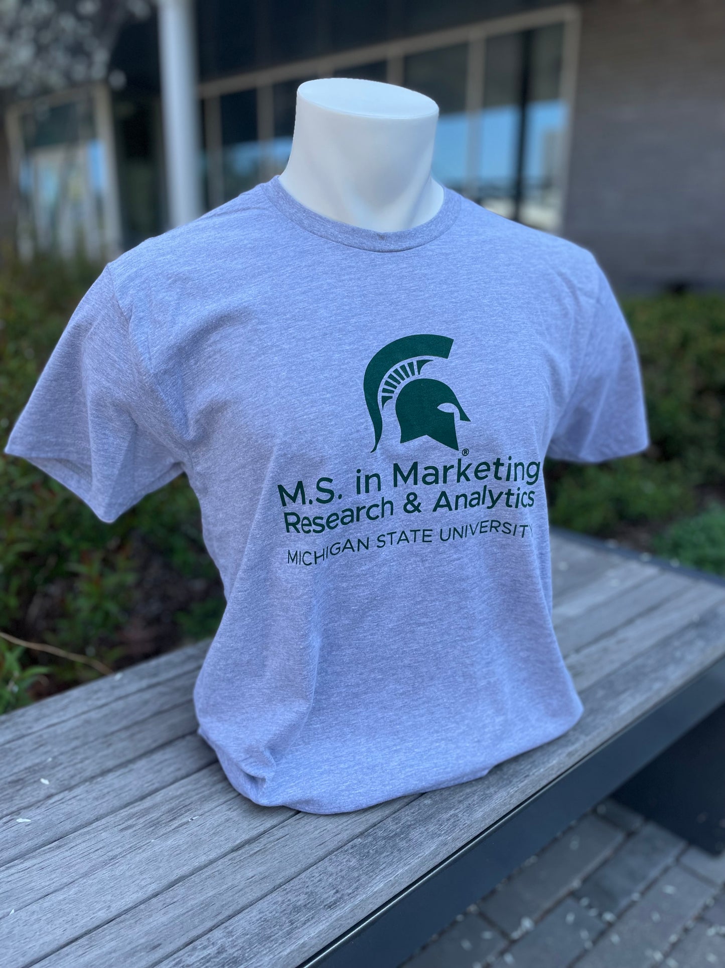 Gray short sleeve T-shirt with the M.S. in Marketing Research & Analytics Michigan State University logo printed in green on the front.