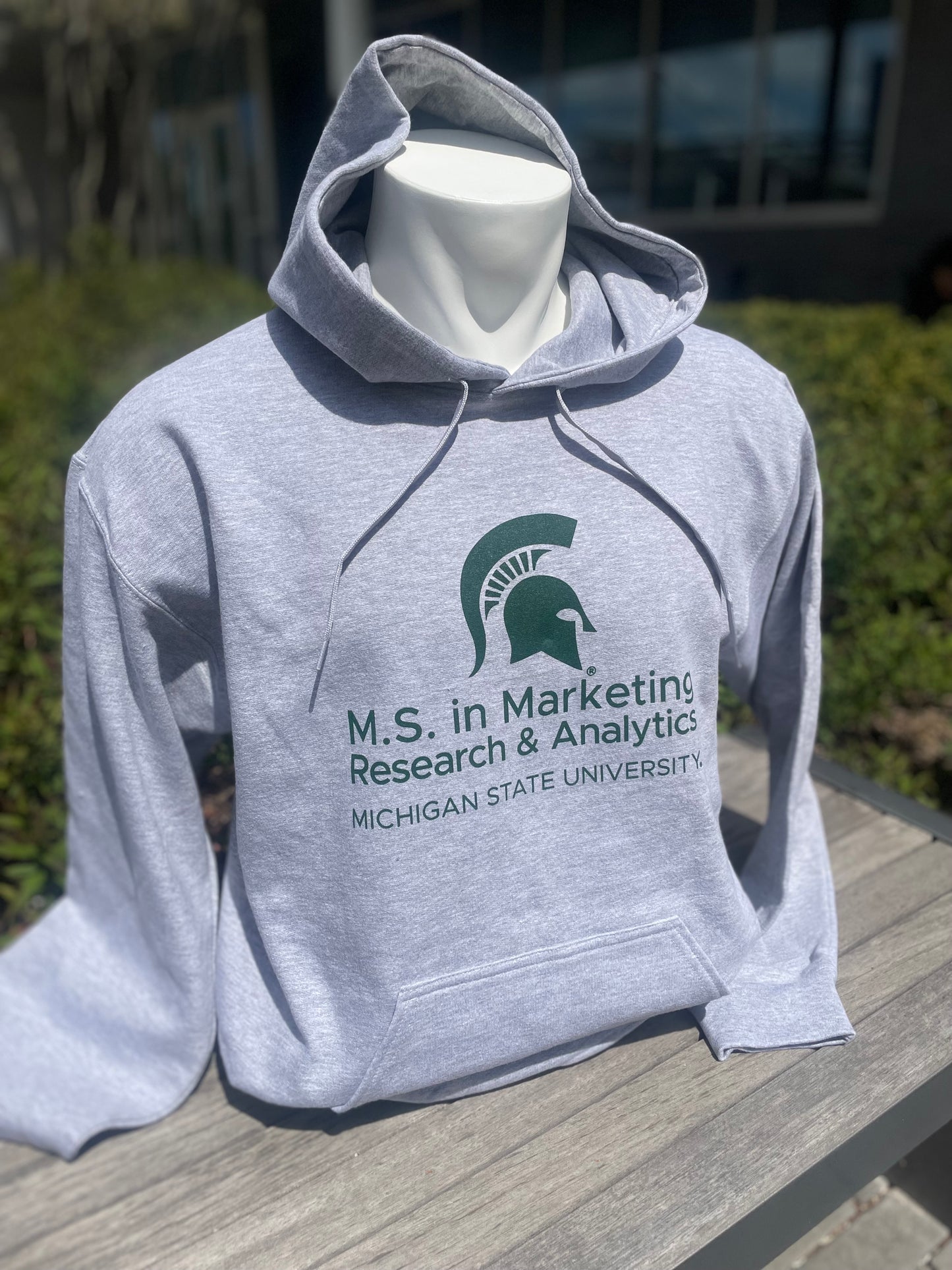 Gray hoodie with the M.S. in Marketing Research & Analytics Michigan State University logo printed in green on the front.