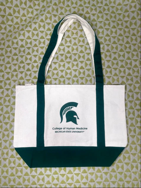 Tote bag with Michigan State University College of Human Medicine screen printed logo, green gusset and handles.