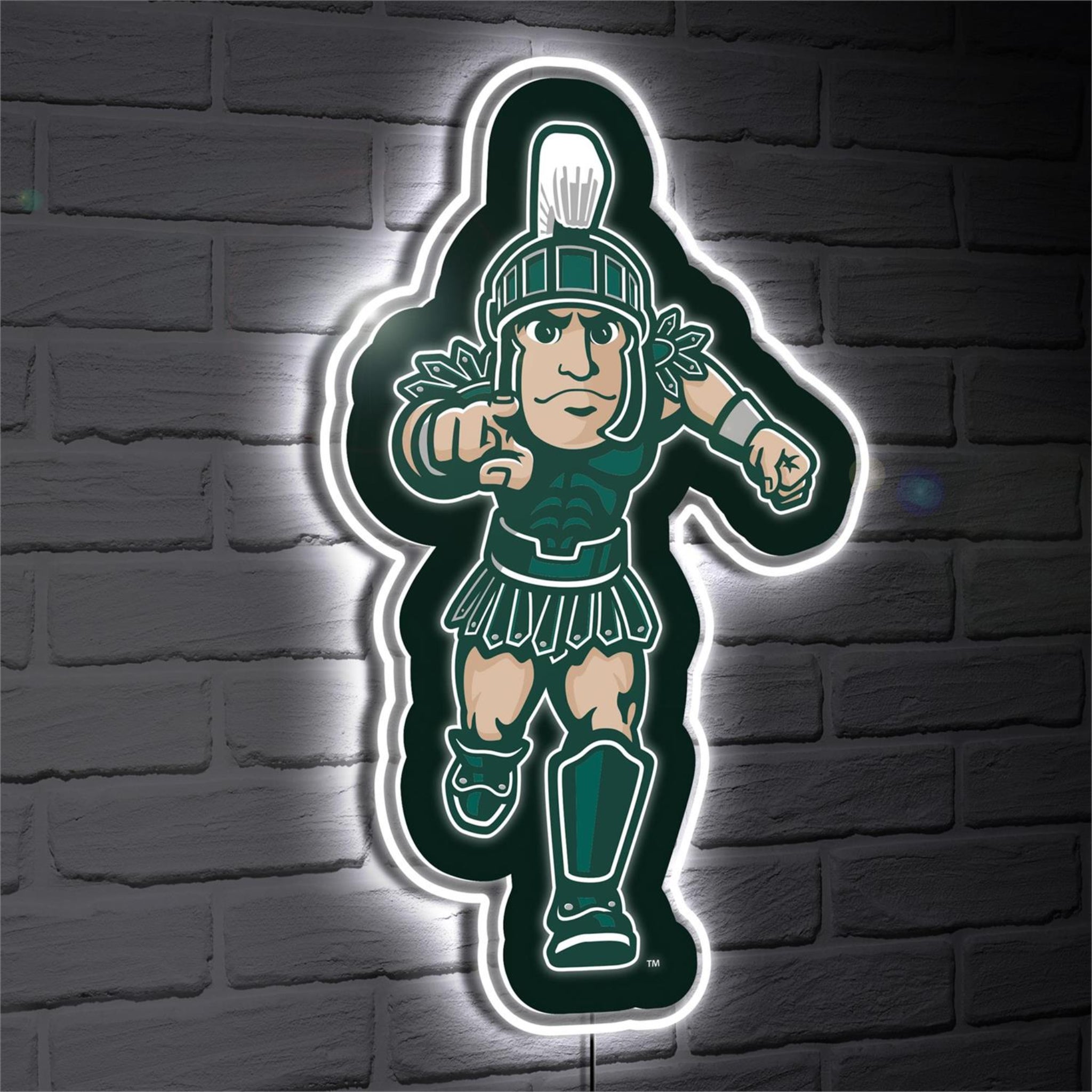 LED sign of a Running Sparty on a brick wall. LED light glowing around the outside of the Running Sparty creating a halo effect.