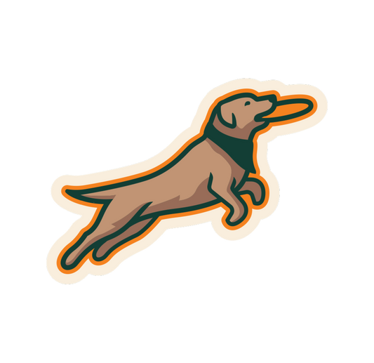 Dog-shaped sticker with a brown dog holding a frisbee in mouth with a green bandana around neck on a white background.