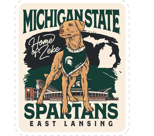Cream Sticker with Zeke the dog on it and text that reads "Home of Zeke" next to it. Behind the dog graphic is a MSU themed design with stacked text below that reads "Spartans East Lansing."