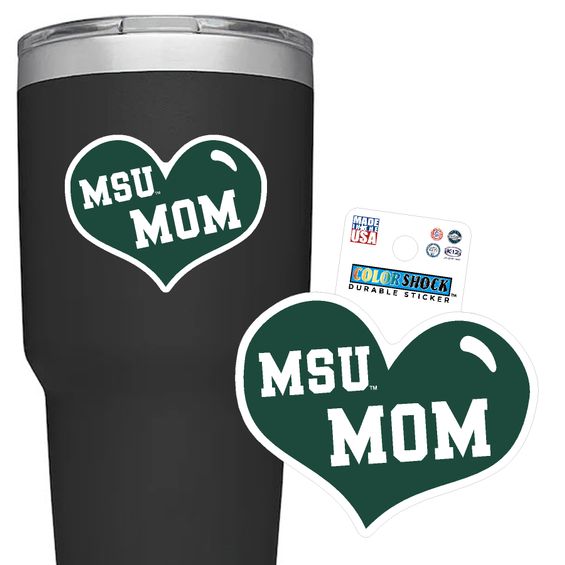 A green heart shaped sticker with white block lettering in center of sticker says 'MSU MOM.'