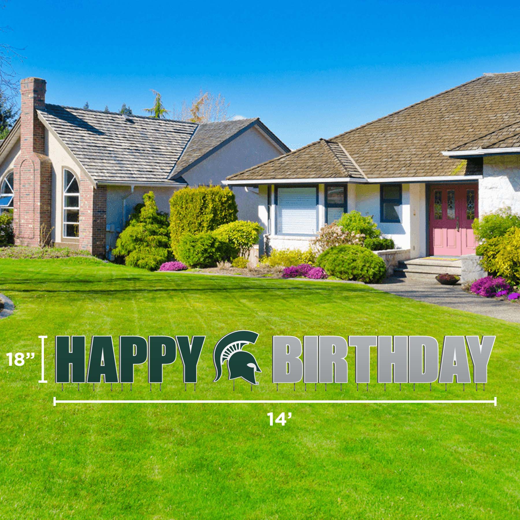 A 'Happy Birthday' lawn display featuring the text in a large, bold font with a green and white color scheme. Spartan Helmet logo in green in between the words happy and birthday.