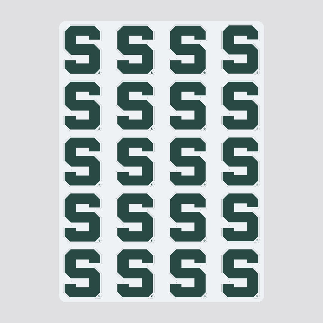 Sticker sheet labeled 'COLOR SHOCK MULTI-PURPOSE STICKERS' featuring 20 identical green Spartan helmet logos representing Michigan State University. The stickers are arranged in four rows of five.