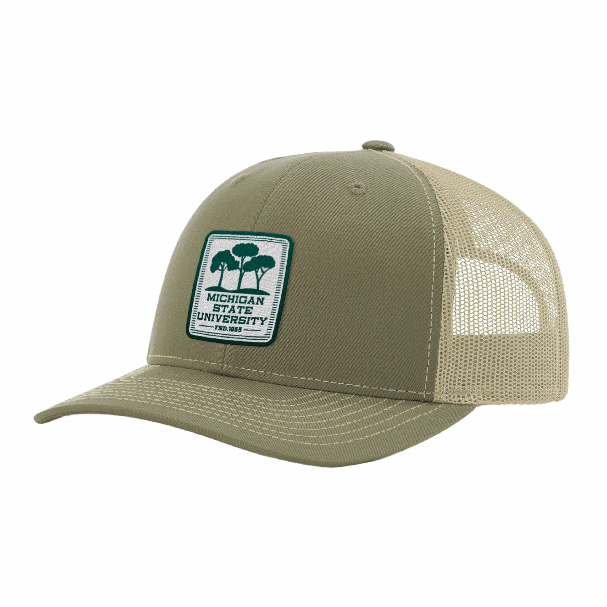 A trucker hat with a green crown and tan mesh, featuring a patch logo on the front that has three green trees and the words "Michigan State University, FND. 1855"