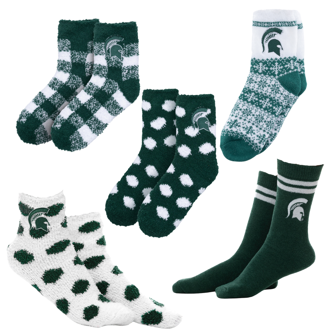 Set of green and white socks with various patterns on a white background