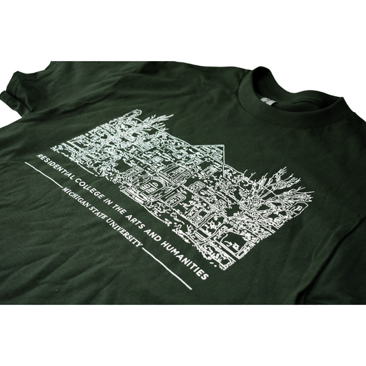 Close-up of the front of a forest green crewneck T-shirt with a white illustrated outline of Snyder-Phillips hall on the center chest. Below that in small all-caps is text reading "Residential College in the Arts and Humanities" above a smaller line of test reading "Michigan State University."
