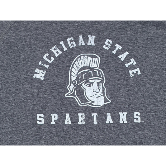 Close-up of a white screen printed rendition of Sparty's head is printed between arched text reading Michigan State and a straight line of text reading Spartans.