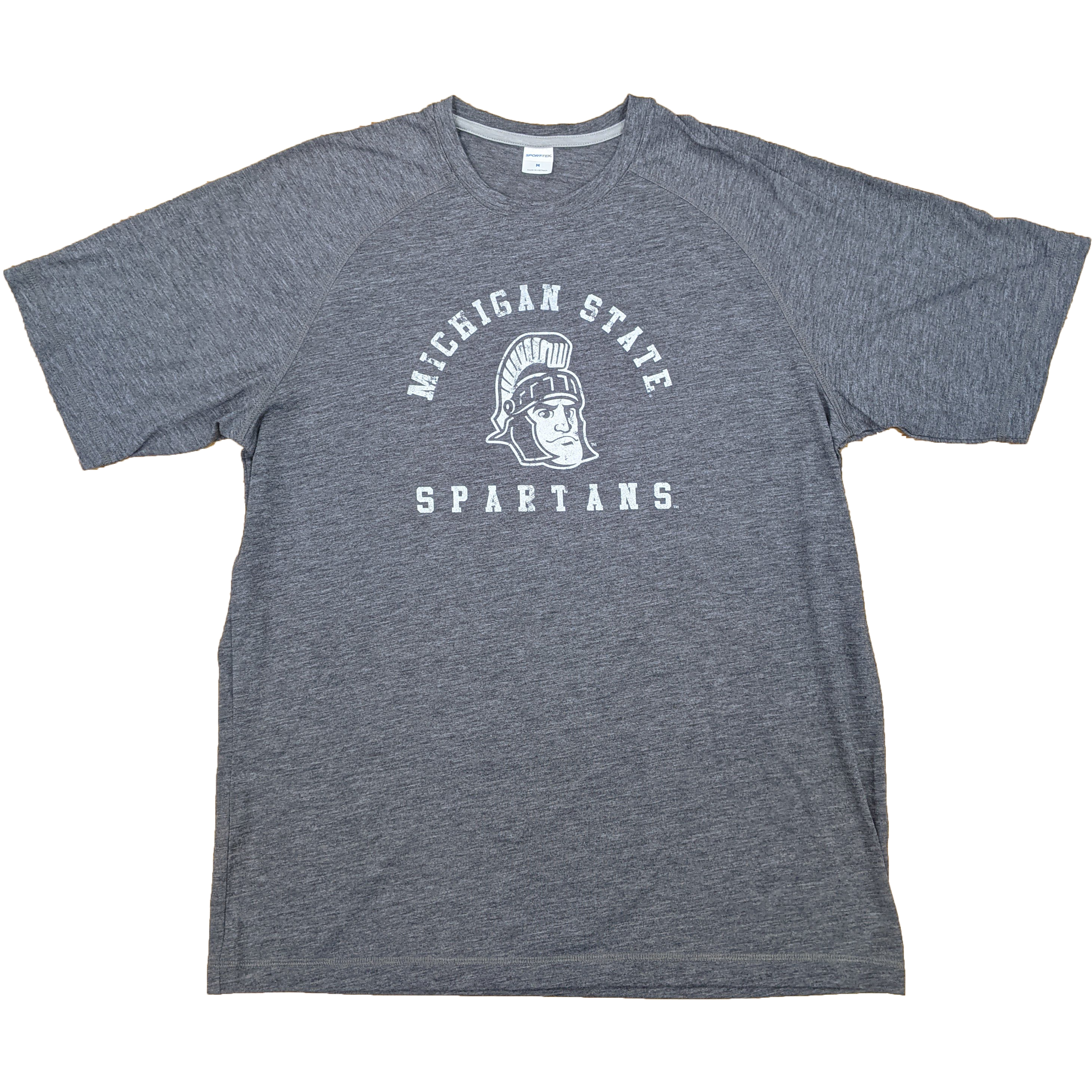 Dark gray crewneck t-shirt. On the center chest, a rendition of Sparty's head is printed between arched text reading Michigan State and a straight line of text reading Spartans. Screen printing is white.