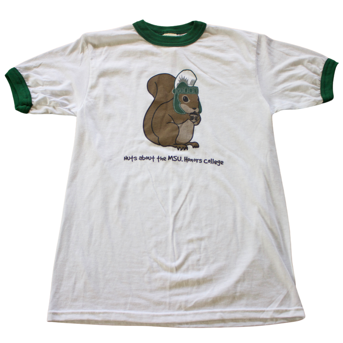 A white T-shirt with green trim on the collar and sleeves. The shirt features a cartoon image of a brown squirrel wearing a green MSU Spartan Helmet. Below the squirrel, black text reads: "Nuts about the MSU Honors College."