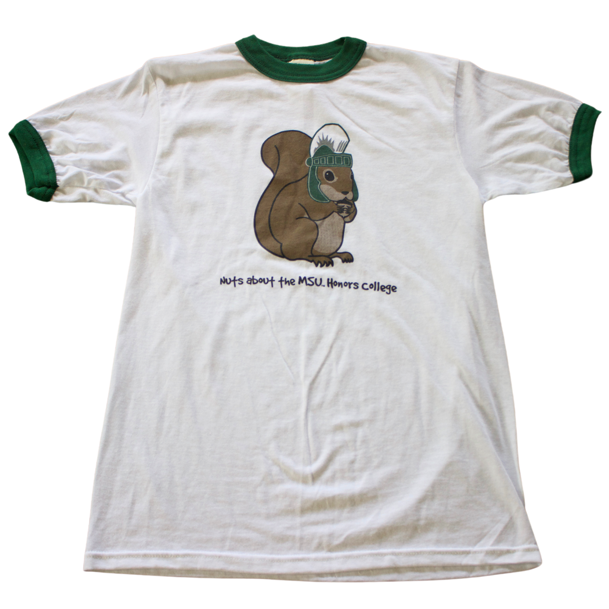 A white t-shirt with green trim on the collar and sleeves. The shirt features a cartoon image of a brown squirrel wearing a Spartan helmet. Below the squirrel, black text reads: "Nuts about the MSU Honors College."