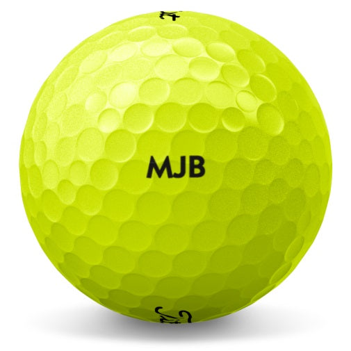 A yellow Titleist golf ball with black text personalized with a name and message.