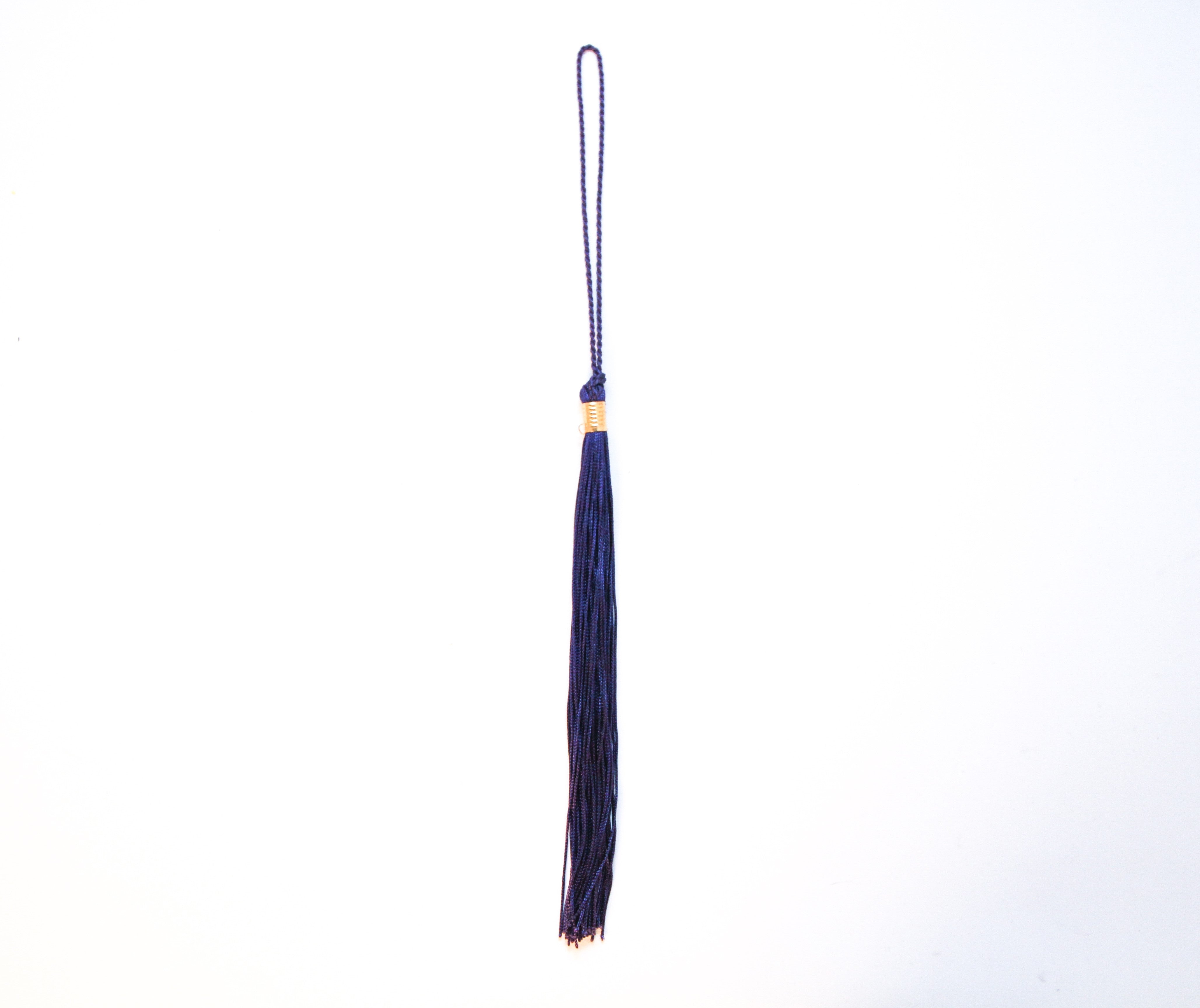 A navy-colored graduation tassel.