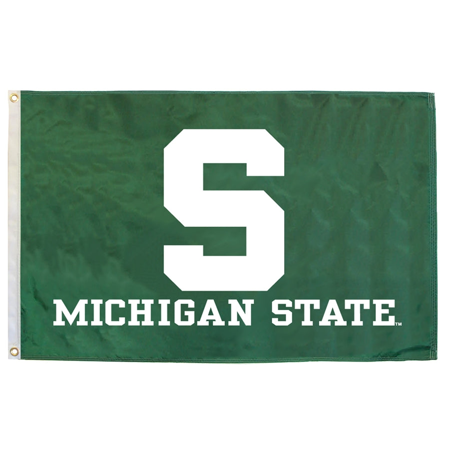 Kelly green flag with a large white block S centered, with white block text reading "Michigan State" underneath. Left side has a white binding with two gold rivets for hanging.