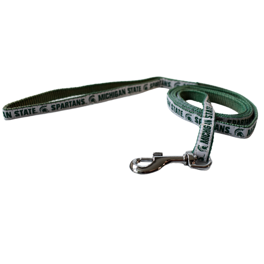 Green woven leash with one side having a solid white ribbon that reads Michigan State and Spartans on either side of a Spartan Helmet logo, all in dark green. At one end is a silver metal spring hook.