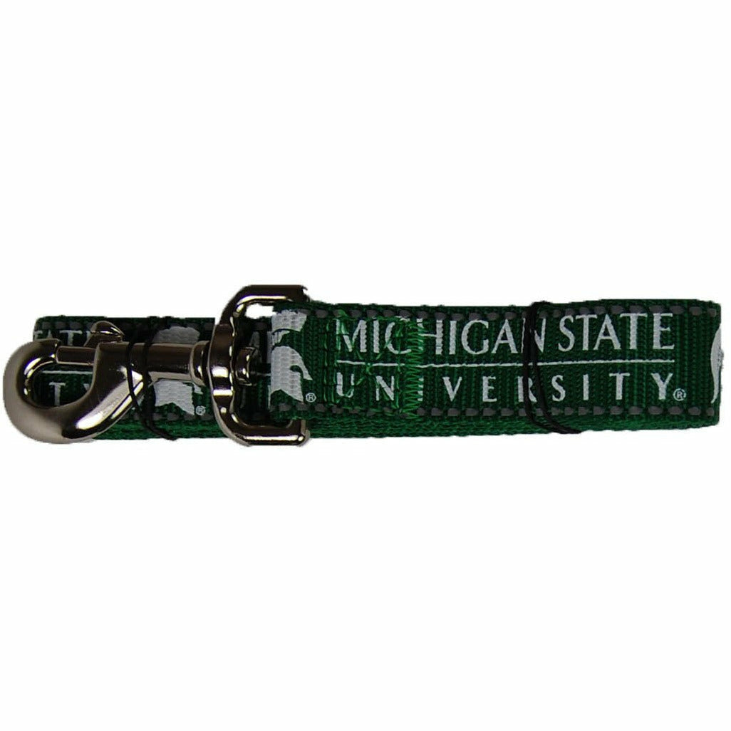 Forest green pet leash with white screen printed Spartan helmets alternating with the MSU wordmark. At one end is a silver spring hook for attaching to collars