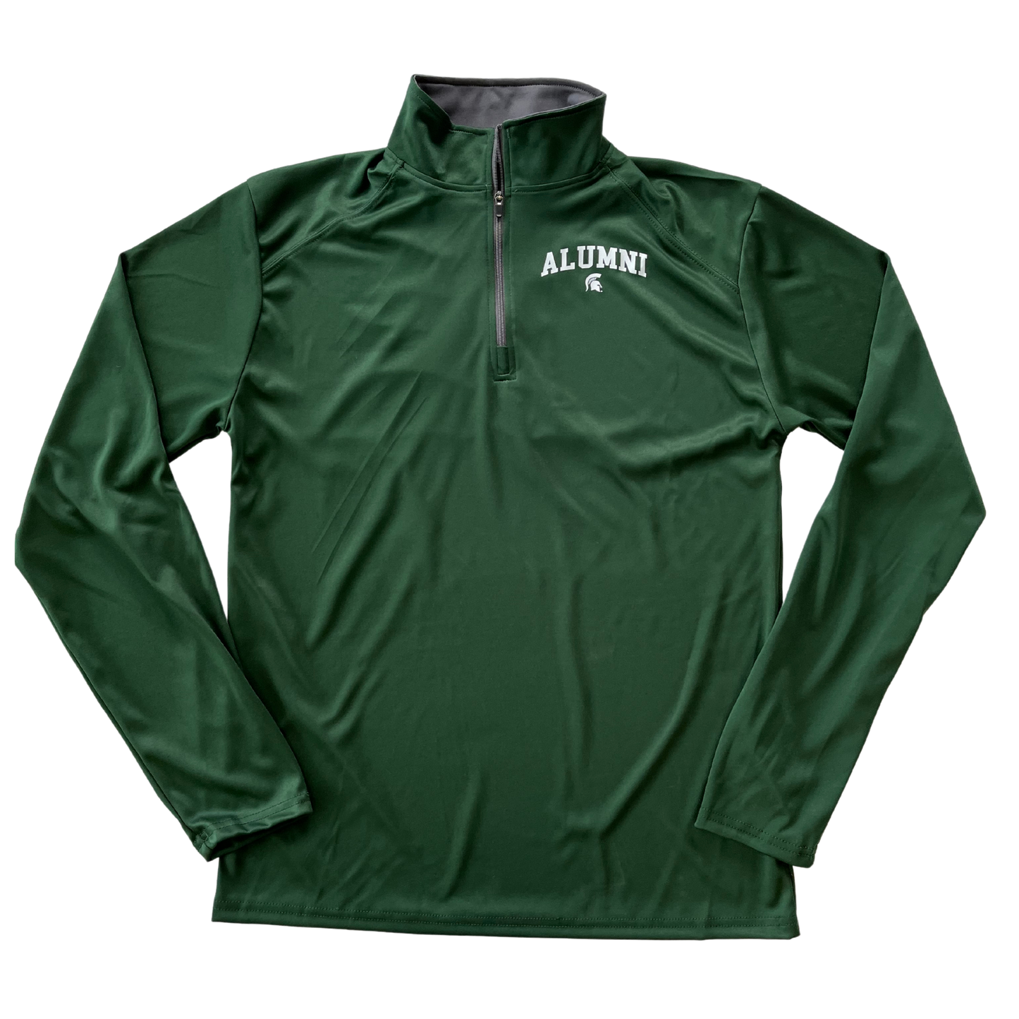 Forest green quarter-zip jacket with faux raglan stitching on the shoulder area and a standing collar. On the left chest, white block letters read “alumni” in a slight arch over a small white Spartan Helmet logo.
