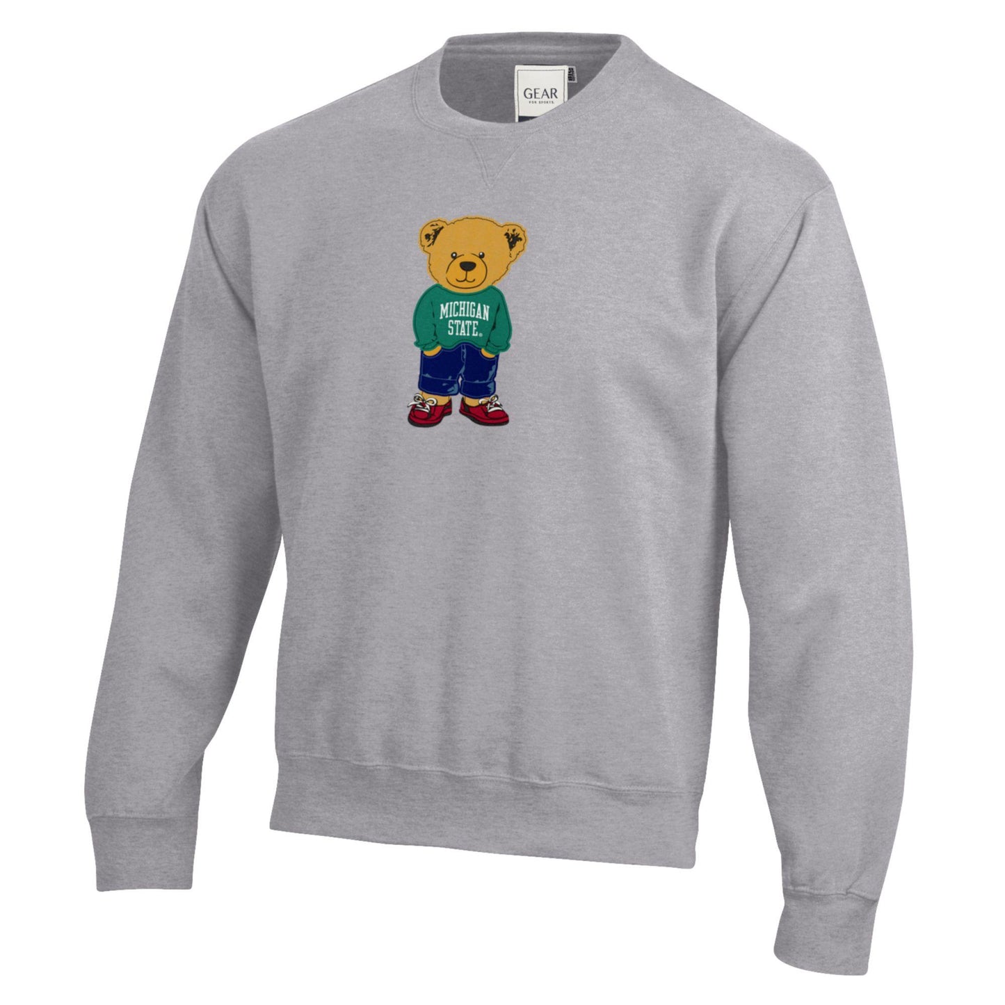 Light gray pullover with a gold teddy bear graphic on the front wearing a green sweater with white text that reads "Michigan State."