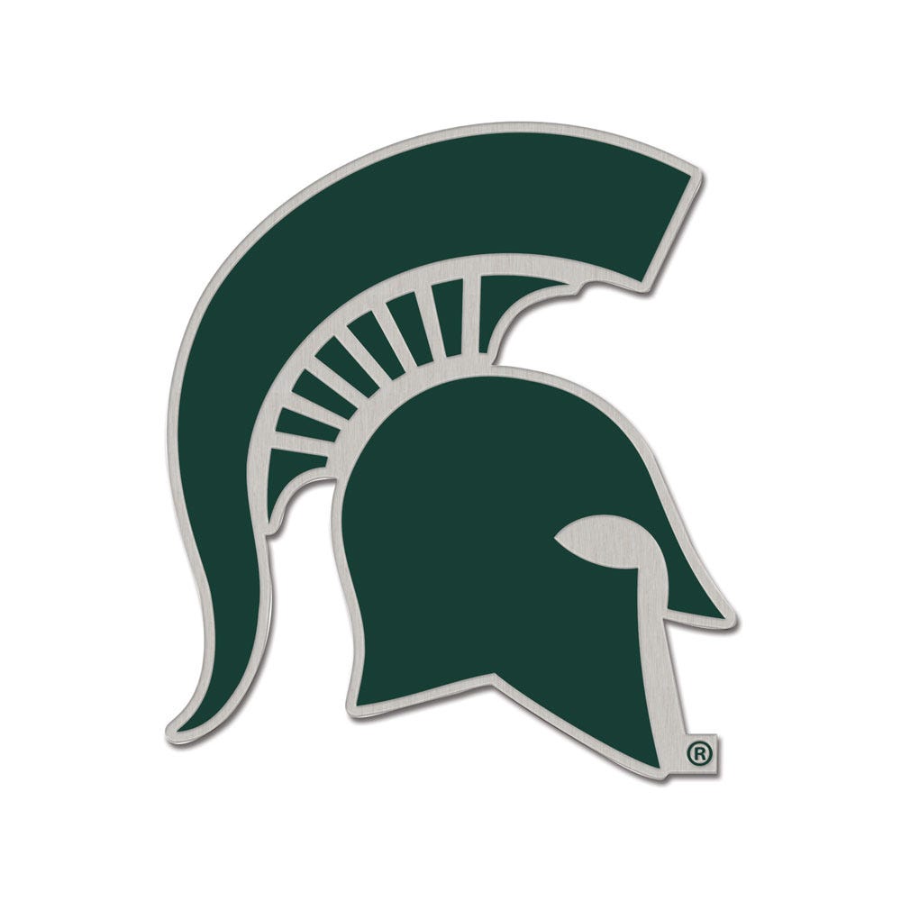 Classic lapel pin in the shape of a Spartan helmet in green on a silver background.