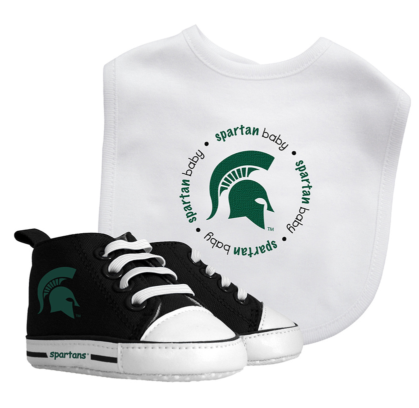 A set of baby fan gear including a white bib with 'spartan baby' and a Spartan helmet design, and black pre-walker sneakers with white laces and the Spartan helmet logo.