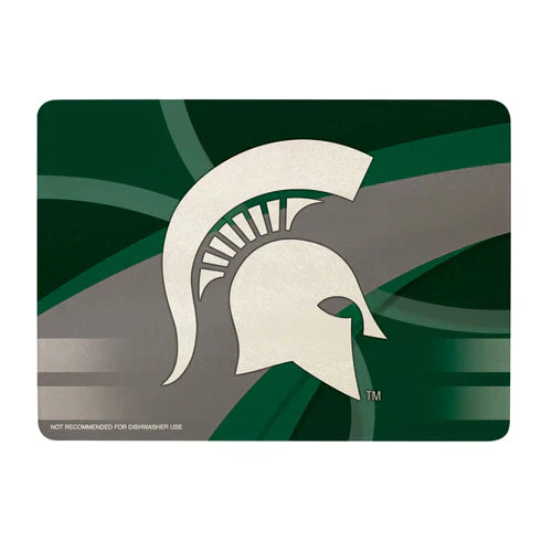 A glass cutting board with a green and gray design and a white Spartan helmet logo in the center.