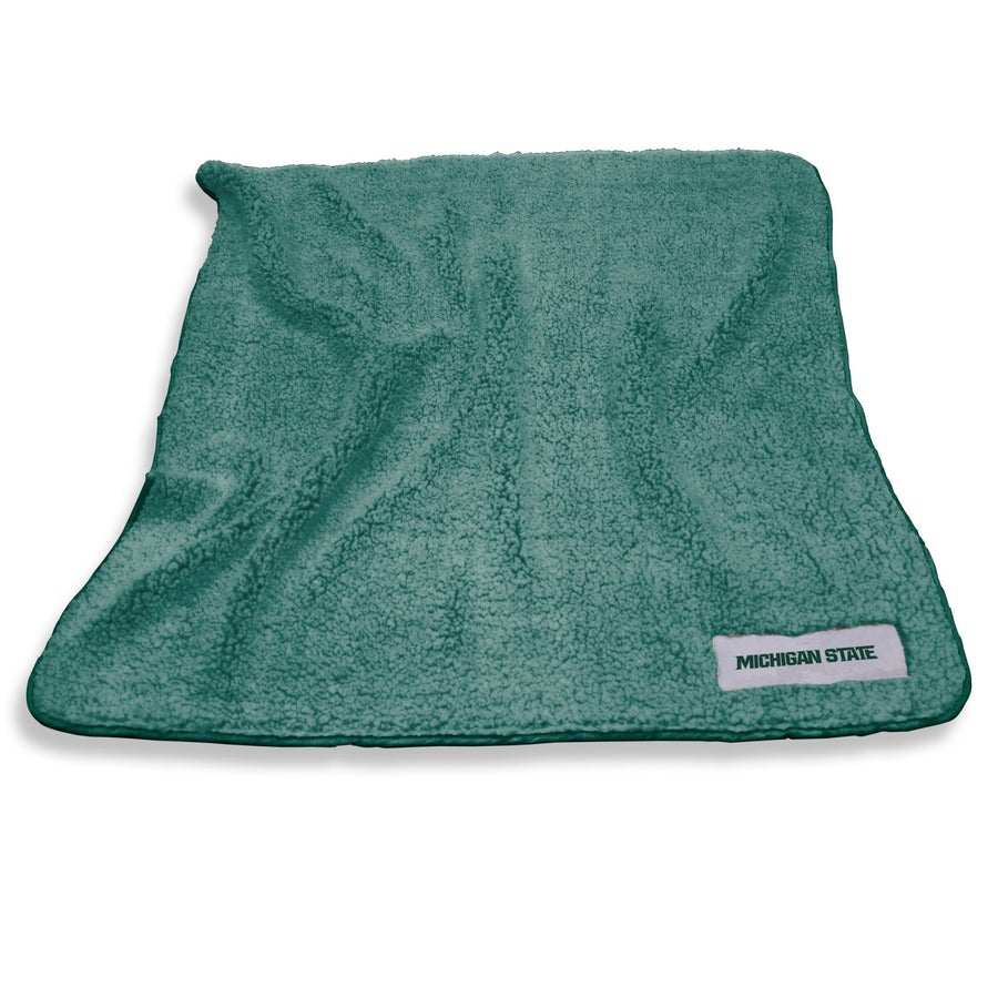 A green fleece blanket with a tag that reads "Michigan State."