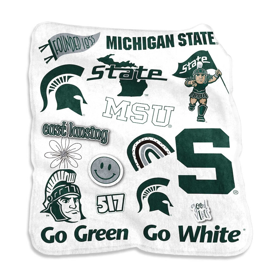 White fleece rectangular blanket with all over various MSU emblems in green and gray.