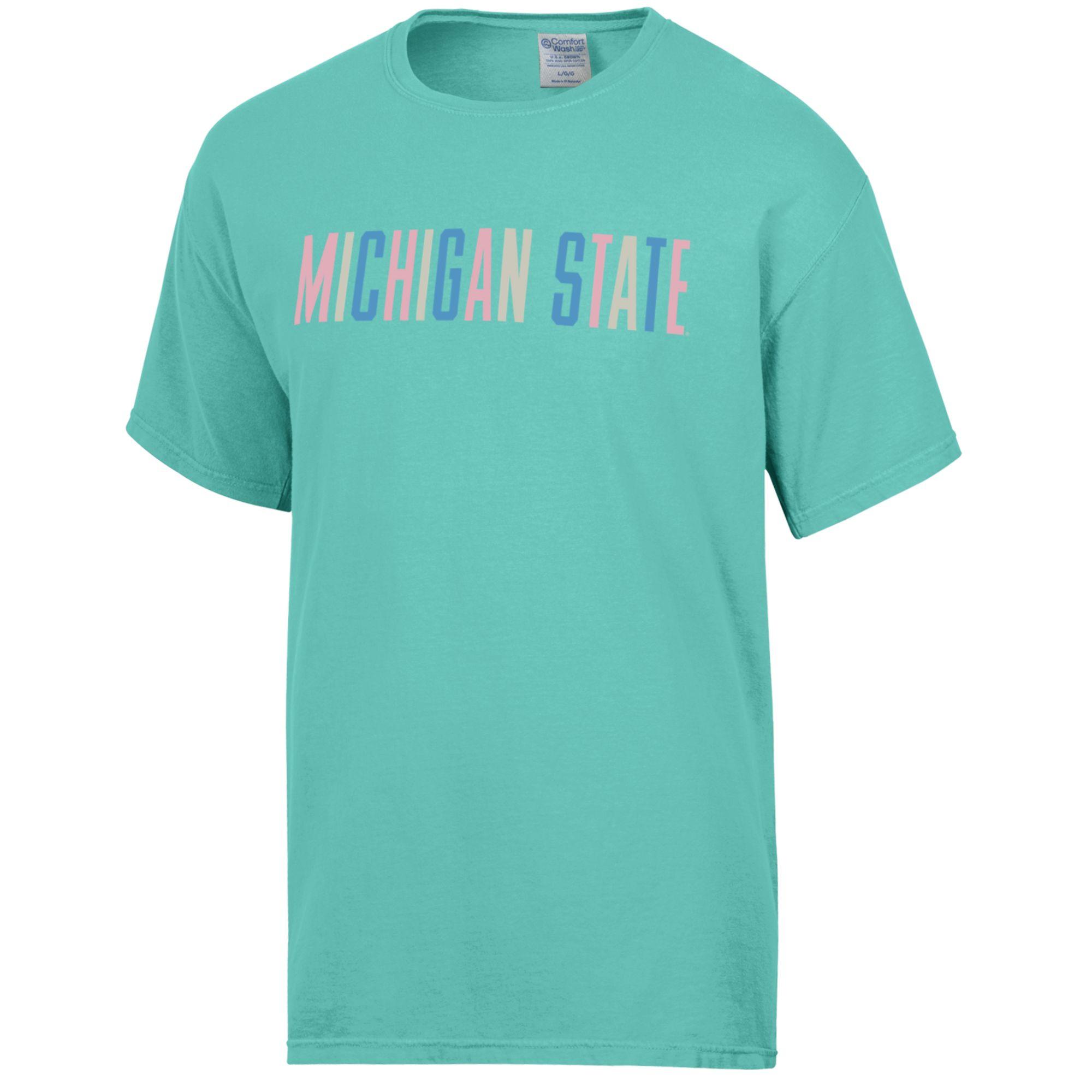 A teal pastel-colored short sleeve T-shirt with 'MICHIGAN STATE' written across the front in multicolor block letters.