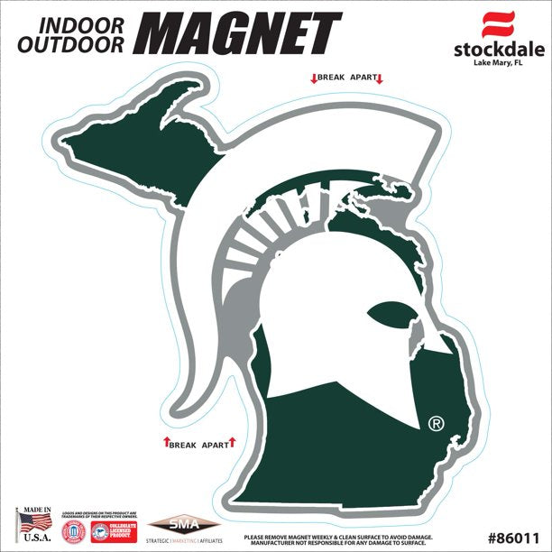 Cutout magnet in the shape of the state of Michigan (dark green) with a large white Spartan Helmet logo overlaid. The entire magnet is outlined in white with "dead space" in a medium gray. Packaging reads "indoor outdoor magnet."