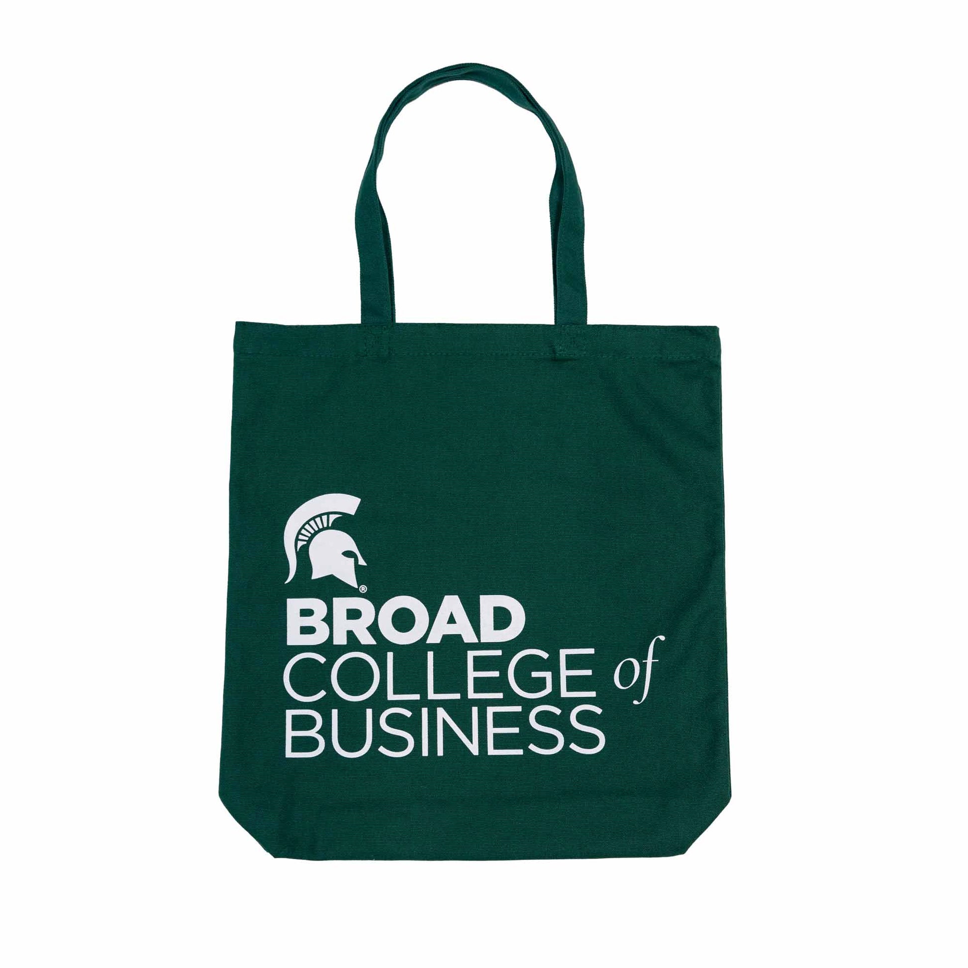 Dark green tote bag with white printing left-aligned in the bottom corner: a Spartan Helmet logo and Broad College of Business in the college's various font format
