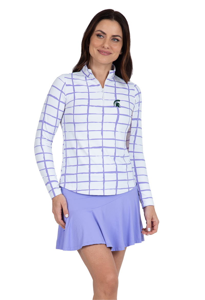 Woman wearing athletic purple plaid long sleeve quarter-zip with a green spartan embroidery on the left upper side. 