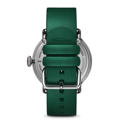 Green Shinola watch with green face and strap featuring white numbers and a white Spartan Helmet logo. Stainless-steel watch casing. 