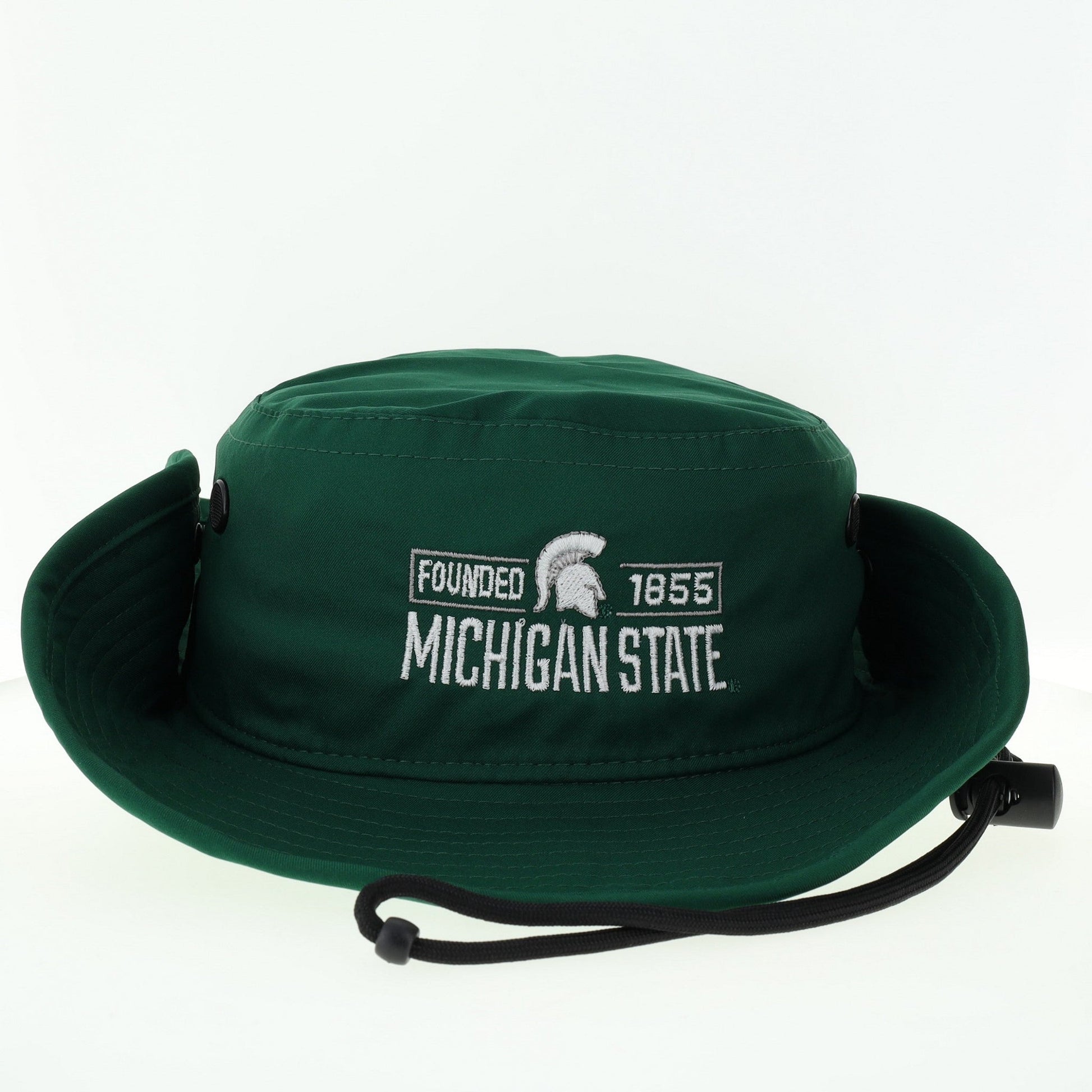 A green bucket hat with white embroidered text "Michigan State" and "Founded 1855' with the Spartan Helmet logo, featuring a drawstring chinstrap, and snap buttons on the side.