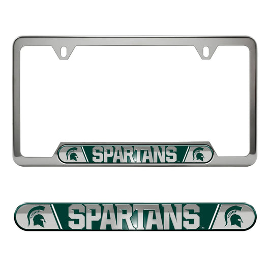 Silver license plate frame with the word "Spartans" written on the bottom and two green Spartan Helmet logos on either side of the text. 