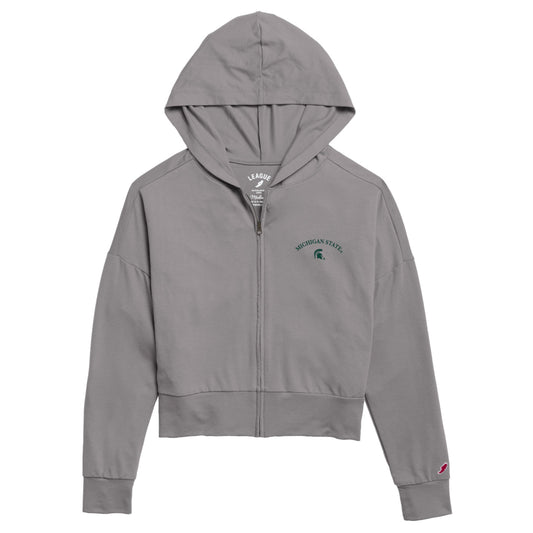Cropped light gray hooded zip up. On the upper left chest is an arched green "Michigan State" wordmark and a green Spartan Helmet logo below it. 