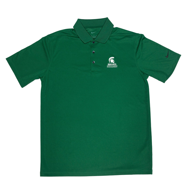 Green short sleeve Nike collared polo with three buttons. A white Spartan helmet over the Broad Supply Chain Management logo is embroidered on the left chest.