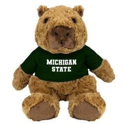 Brown plush capybara wearing a green "Michigan State" Shirt. 