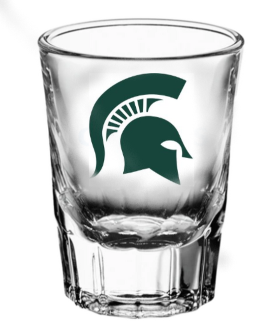 Clear shot glass that has a green Spartan Helmet on the center. 