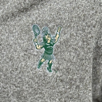 Close up of the embroidered Sparty playing tennis on the upper left chest of the full zip jacket.